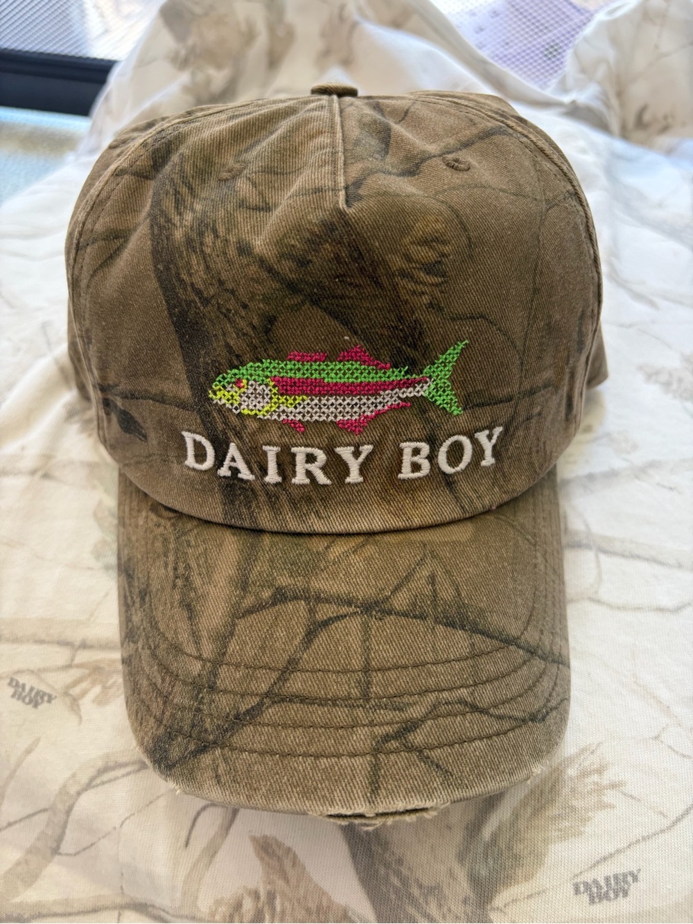Dairy Boy Embroidered Fish Camo Trucker Cap